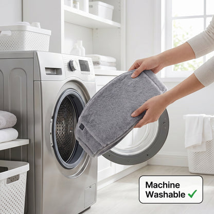 Hands placing grey heated belt into a washing machine
